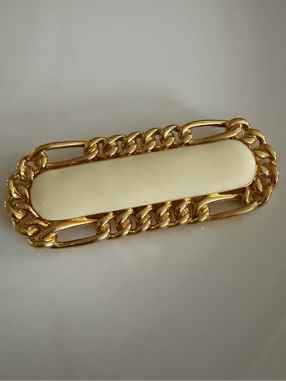 Vintage Monet Gold-Tone Chain Brooch with Cream Enamel Accent